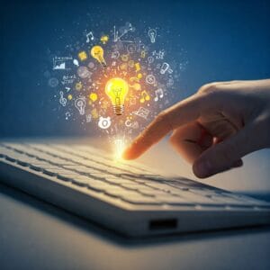 mano che tocca la tastiera del pc e ne escono idee, rappresentate da lampadine e simboli